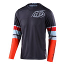The Troy Lee Designs GP AIR JERSEY WARPED CHARCOAL / ORANGE is a lightweight, ventilated race jersey ideal for warm weather, with a charcoal/ orange body, mesh polyester panels, and bold geometric and script logo accents.