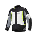 The Alpinestars ST-1 Waterproof Jacket by Crown Kiwi Enterprises Limited showcases a stylish blend of black, white, and gray with neon yellow accents. It features a zip-up front and adjustable side straps for ergonomic mobility, along with branding on the chest and sleeves. Its multiple panels ensure both style and protection.