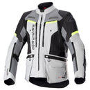 The Alpinestars Bogota Pro Drystar Jacket in gray and black prominently features "alpinestars" on the left chest. It has multiple pockets, zipper details, neon yellow for visibility, is waterproof, and includes ventilation panels for comfort in all conditions.