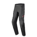 A pair of Alpinestars Andes Air Drystar Pants by ALPINESTARS in black, featuring a red logo. These dual-season touring pants offer reinforced knees and adjustable waist straps for 100% waterproof protection, perfect for motorsports enthusiasts.