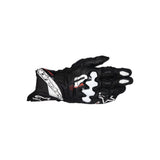 The ALPINESTARS Gp Plus R V3 Gloves in black, white, and red are displayed flat with the leather palm down, showing strong knuckle protectors and precision stitching.
