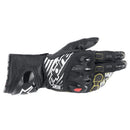 The Alpinestars GP Tech v2 Gloves by Crown Kiwi Enterprises Limited feature a black and white design with yellow stitching, red knuckle accents, finger armor, Kevlar stretch for flexibility, and a mesh design for ventilation.