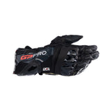 The black Alpinestars GP Pro R4 Gloves by Crown Kiwi Enterprises Limited boast protective armor, "GP PRO" on the wrist, detailed stitching, reinforced knuckle protectors, and a performance gauntlet design.