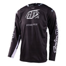 The Troy Lee Designs GP PRO JERSEY BLENDS CAMO BLACK / WHITE is a black long-sleeve motocross top with white branding, "Troy Lee Designs" on the sleeves, "GRAND PRIX" on the front, and ventilated mesh panels for breathability.
