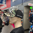 Front and rear views of the 100% cotton camouflaged Honda Cap Camo. The front features a prominent "HONDA" logo with a stylized wing above the text, while the back of the cap is black mesh with an adjustable snapback strap by HRC.