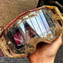 Three green lens protectors are shown beside black and orange Armor Vision packaging labeled “ARMOR VISION SMARTFILM 50MM (PACK OF 3),” featuring a tear-off replacement system and retro-fit lens protector promotion.