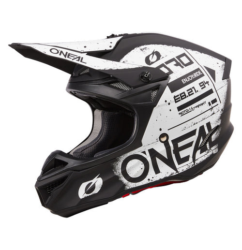 Top view of the black and white O'Neal 2024 5SRS SCARZ Helmet from ONEAL. This off-road motorcycle helmet boasts a bold design with stylized graphics, featuring the prominent O'Neal logo. It has an aerodynamic shape with air vents and is constructed from durable ABS material that meets ECE 22-06 safety standards.