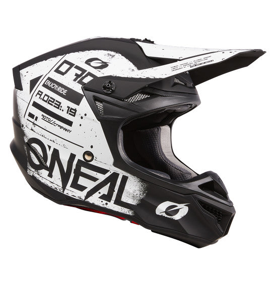 Top view of the black and white O'Neal 2024 5SRS SCARZ Helmet from ONEAL. This off-road motorcycle helmet boasts a bold design with stylized graphics, featuring the prominent O'Neal logo. It has an aerodynamic shape with air vents and is constructed from durable ABS material that meets ECE 22-06 safety standards.