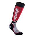 The Alpinestars Youth MX Plus Sock by Crown Kiwi Enterprises Limited is a single, knee-high athletic sock featuring a red and black design with the word "compress" in white letters. It includes a grey foot area alongside black toe and cuff sections, designed to ensure moisture-wicking and breathability for ultimate comfort.