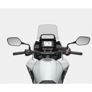 The Honda NX500, a sleek and modern motorcycle by Honda, showcases a silver and black color scheme with programmed fuel injection. It features a prominent windshield, angular design elements, and alloy wheels. The side profile accentuates its sporty and aerodynamic build.