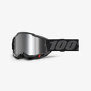 The Accuri 2 Youth Goggle Black by 100% features a reflective lens, adjustable strap with "100" in bold, and vented frames. Designed specifically for young motocross riders, these high-performance goggles boast a modern, angular look.
