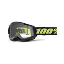 The Strata 2 Goggle Solar Eclipse by 100% features black and clear motocross goggles with anti-fog lenses, a black strap displaying "100%" in bright yellow, a slightly angular design, side ventilation, and compatibility with tear-offs for optimal visibility.