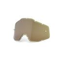 The Adult Injected Lens Olive by 100% is a single tan, angular motorcycle goggle lens crafted as a polycarbonate shield. It features notches for frame fitting and offers a slight gradient shading with Filter Category 2, providing 23% light transmission.