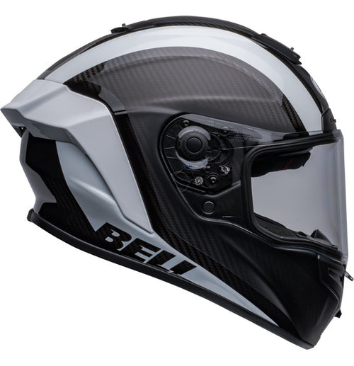 Side view of the Bell RACE STAR DLX FLEX Tantrum 2 Black/White helmet with a clear visor. The helmet boasts a sleek design with aerodynamic contours, Velocity Flow Ventilation, and a textured pattern on the top and sides. A Carbon Fiber Shell ensures durability, while the BELL logo is prominently displayed.