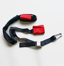 An X-TECH Handlebar Harness Combo with Tiedowns, featuring a black nylon strap with a carabiner at one end and a buckle in the middle, and red padded sections for comfort and protection, is laid out flat on a light surface.