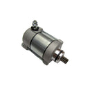 The RICK'S STARTER MOTOR RICKS MOTORSPORT HONDA is a sleek, industrial cylindrical metal starter motor featuring a silver body with dark ends. It includes an output shaft on the right side, connection terminals on the top left, and mounting points at the base. For your peace of mind, this starter motor comes with a one-year product warranty.