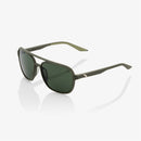 The Kasia Soft Tact Army Green sunglasses by Crown Kiwi Enterprises Limited feature dark lenses and sleek square frames with metallic temple accents. They offer UV protection and ultra-lightweight comfort, photographed on a white background.