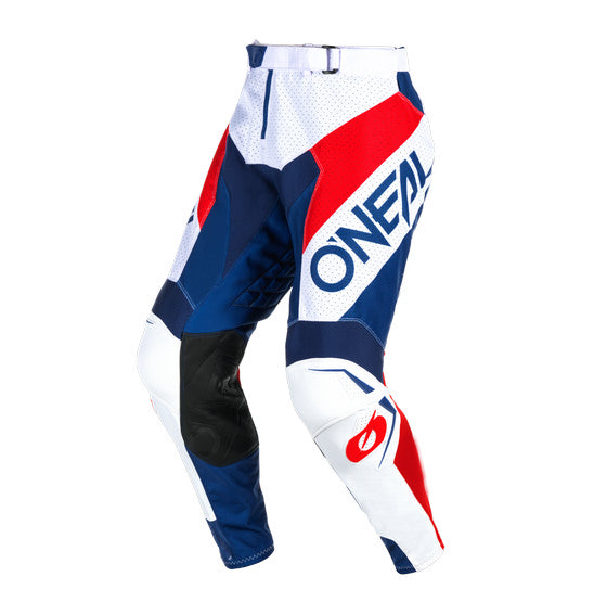 A person wearing the ONEAL O'Neal 2025 HARDWEAR AIR Slam Pant in White/Blue/Red, designed with vented construction and ergonomic fit, stands hands on hips facing away from the camera against a white background.