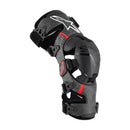 The Alpinestars RK-10 Plasma Knee Brace from Crown Kiwi Enterprises Limited boasts a sleek black and gray design with adjustable straps and a protective shell. Its carbon fiber frame provides superior strength, while logos and red accents enhance its style, making it an ideal choice for athletic support and protection.