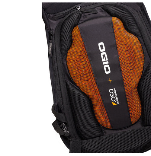 The Ogio MACH 5 D30 Motorcycle Backpack - Stealth is a sleek black backpack featuring a hard shell cover, designed specifically for street riders. It includes two white accent lines running vertically along the edges and prominently displays the OGIO logo in white. For added comfort and protection, the backpack has padded shoulder straps and advanced back support.