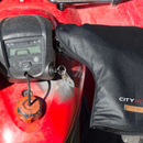A pair of black Oilskin Fur Lined ATV Mitts by STYX MILL, designed for scooters or bicycles, with inner fur lining. One mitt displays the "CITYHORN" label in red and white text, shown on a white background.