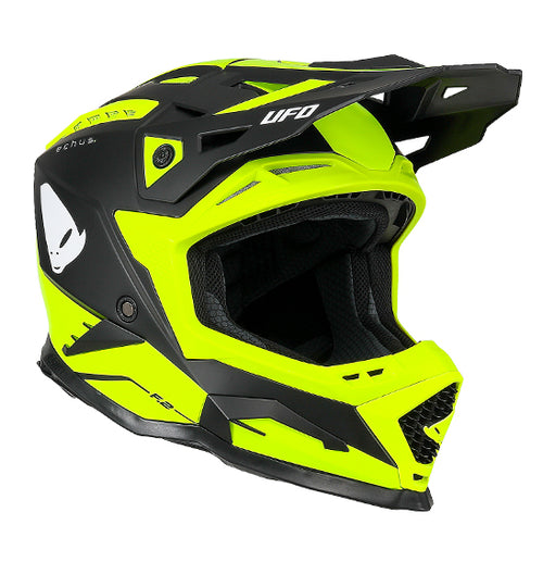 The UFO Echus Helmet in neon yellow and black features angular geometric designs, an alien logo near the back, and "UFO" branding. ECE 22.06 certified, it ensures top-notch safety for off-road adventures with its visor-equipped design.