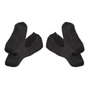 The image displays two Troy Lee Designs SE4 CHEEKPADS BLACK, made of textured foam, positioned side by side on a white background and facing each other.