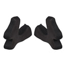 The image displays two Troy Lee Designs SE4 CHEEKPADS BLACK, made of textured foam, positioned side by side on a white background and facing each other.