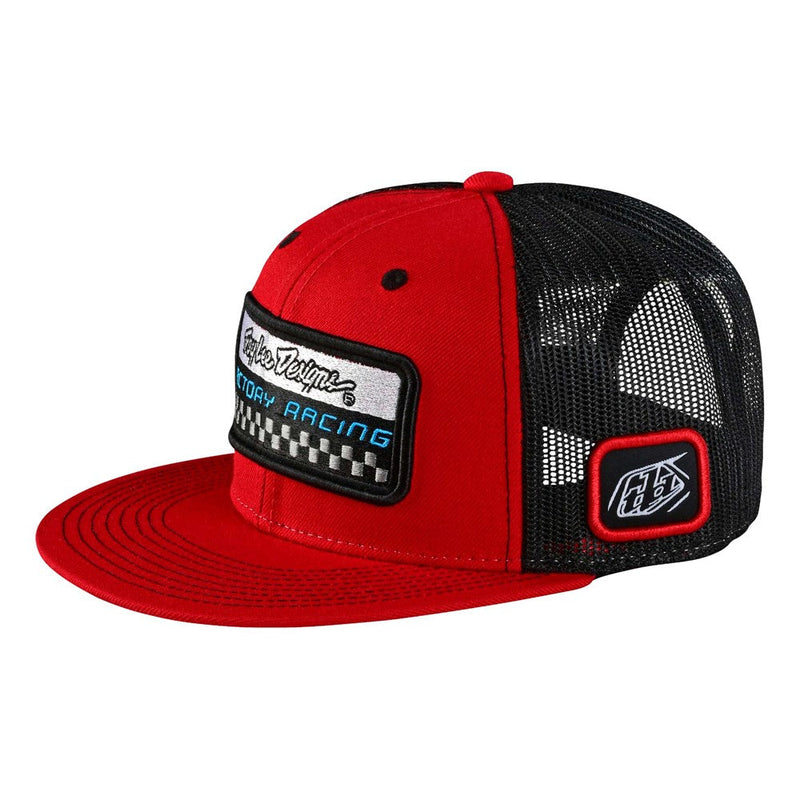 The Troy Lee Designs TLD FACTORY PIT CREW SNAPBACK HAT RED is a red and black trucker hat featuring a high crown and flat brim. The solid red front panel showcases patches with "Factory Racing" text and a checkered design, while the black mesh side and back panels include an additional patch, perfect for any pit crew look.