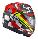 The Arai RX-7V EVO - IOM TT 2023 Limited Edition motorcycle helmet features vibrant graphics in red, black, white, and neon yellow. This colorful design includes the Arai logo, an "Isle of Man" label, and a stylized flag design. The helmet comes with a clear visor, meets ECE R22-06 standards, and boasts an aerodynamic shape perfect for the Arai Isle of Man TT.