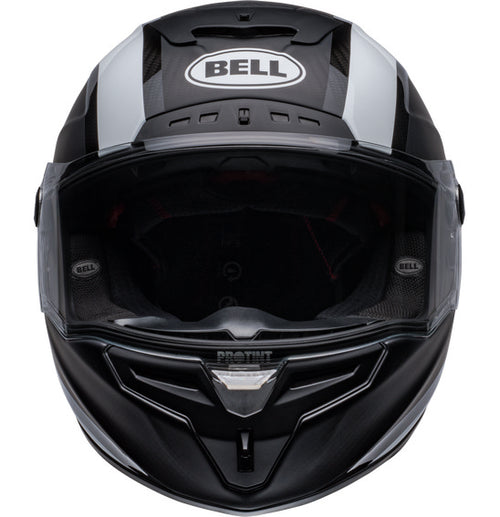 Side view of the Bell RACE STAR DLX FLEX Tantrum 2 Black/White helmet with a clear visor. The helmet boasts a sleek design with aerodynamic contours, Velocity Flow Ventilation, and a textured pattern on the top and sides. A Carbon Fiber Shell ensures durability, while the BELL logo is prominently displayed.