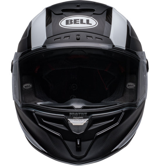 Side view of the Bell RACE STAR DLX FLEX Tantrum 2 Black/White helmet with a clear visor. The helmet boasts a sleek design with aerodynamic contours, Velocity Flow Ventilation, and a textured pattern on the top and sides. A Carbon Fiber Shell ensures durability, while the BELL logo is prominently displayed.
