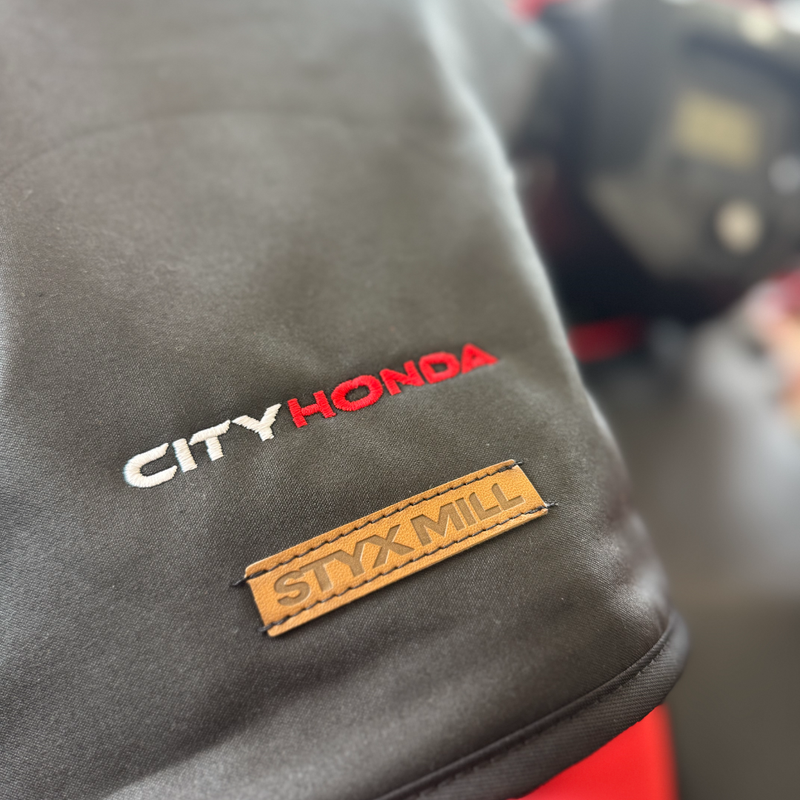 A pair of black Oilskin Fur Lined ATV Mitts by STYX MILL, designed for scooters or bicycles, with inner fur lining. One mitt displays the "CITYHORN" label in red and white text, shown on a white background.
