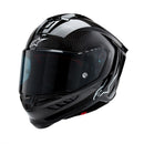 Presenting the Supertech R10 Helmet Solid Black Carbon Matte/Gloss by Crown Kiwi Enterprises Limited: a stylish road racing helmet that combines a glossy finish and advanced aerodynamics. It boasts a smoked visor, ventilation slits, and subtle graphic accents, making it perfect for high-speed riding. This helmet ensures top performance and style on every journey.