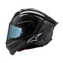 Presenting the Supertech R10 Helmet Solid Black Carbon Matte/Gloss by Crown Kiwi Enterprises Limited: a stylish road racing helmet that combines a glossy finish and advanced aerodynamics. It boasts a smoked visor, ventilation slits, and subtle graphic accents, making it perfect for high-speed riding. This helmet ensures top performance and style on every journey.