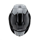 Presenting the Supertech R10 Helmet Solid Black Carbon Matte/Gloss by Crown Kiwi Enterprises Limited: a stylish road racing helmet that combines a glossy finish and advanced aerodynamics. It boasts a smoked visor, ventilation slits, and subtle graphic accents, making it perfect for high-speed riding. This helmet ensures top performance and style on every journey.