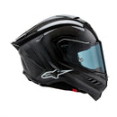 Presenting the Supertech R10 Helmet Solid Black Carbon Matte/Gloss by Crown Kiwi Enterprises Limited: a stylish road racing helmet that combines a glossy finish and advanced aerodynamics. It boasts a smoked visor, ventilation slits, and subtle graphic accents, making it perfect for high-speed riding. This helmet ensures top performance and style on every journey.
