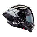 The ALPINESTARS Supertech R10 Helmet Element flaunts a sleek carbon and silver design with advanced aerodynamics. It features a glossy finish, angular patterns, a large tinted visor, and showcases a prominent logo on the front with subtle side text.