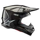 The ALPINESTARS Supertech S-M10 Helmet in Black Gloss Carbon features a sleek design with ventilation slits, an adjustable visor, and a white "SM10" logo near the top, along with the brand's iconic white logo on the side.