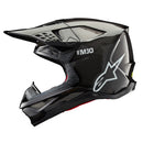 The ALPINESTARS Supertech S-M10 Helmet in Black Gloss Carbon features a sleek design with ventilation slits, an adjustable visor, and a white "SM10" logo near the top, along with the brand's iconic white logo on the side.