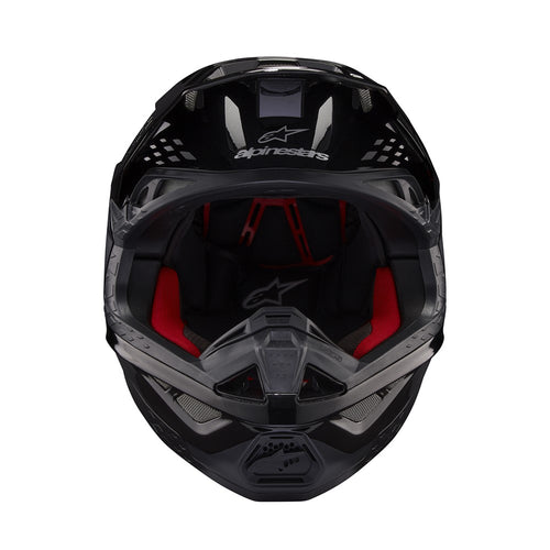 The Supertech S-M10 Helmet Flood Black/Dark Gray by Crown Kiwi Enterprises Limited features a sleek design with a glossy black finish and dark gray accents. Its aerodynamic profile is characterized by angular lines, a protective visor, and strategically placed vents for optimal ventilation.