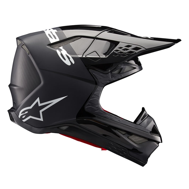 The Supertech S-M10 Helmet Flood Black/Dark Gray by Crown Kiwi Enterprises Limited features a sleek design with a glossy black finish and dark gray accents. Its aerodynamic profile is characterized by angular lines, a protective visor, and strategically placed vents for optimal ventilation.