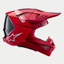 The Crown Kiwi Enterprises Limited Supertech S-M10 Flood Red Fluoro/Red Matte/Gloss helmet features a sleek design with aerodynamic elements, including a visor and ventilation openings. This performance-enhancing helmet displays a white star logo on the side against a simple background.