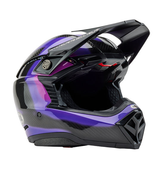 The Bell MOTO-10 SPHERICAL Flare Gloss Purple is a sleek, full-face motocross helmet with a dynamic design in shades of purple and black. It is enhanced by MIPS Spherical Technology for superior safety, features a visor, and proudly displays the "Bell" brand logo on the side. Carbon fiber detailing adds the finishing touch to its style.