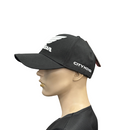 Showcasing the Honda Cap Black, branded by HRC, this cap displays a chic design from both front and back angles. The front prominently features the white Honda logo with stylized wings and "HONDA," set against a black background. Crafted from 100% cotton, the back of the cap includes an adjustable snapback strap, ensuring a perfect fit.