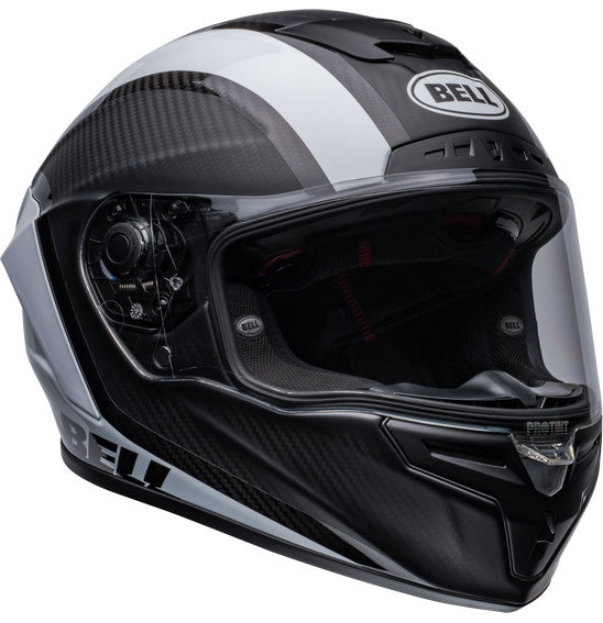 Side view of the Bell RACE STAR DLX FLEX Tantrum 2 Black/White helmet with a clear visor. The helmet boasts a sleek design with aerodynamic contours, Velocity Flow Ventilation, and a textured pattern on the top and sides. A Carbon Fiber Shell ensures durability, while the BELL logo is prominently displayed.