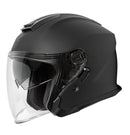 The FREIGHT RJAYS NAVONA IV Helmet in matte black, featuring a transparent visor and shown in profile, boasts a streamlined design with an injection moulded ABS shell. It also includes an integrated internal sun-shield mechanism for superior protection under varying light conditions.