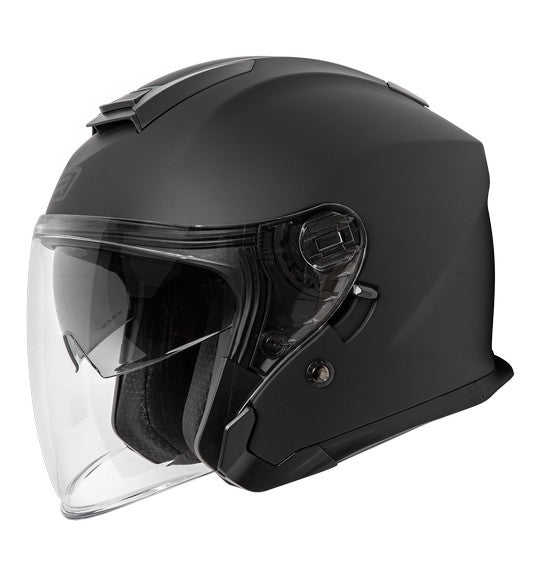 The FREIGHT RJAYS NAVONA IV Helmet in matte black, featuring a transparent visor and shown in profile, boasts a streamlined design with an injection moulded ABS shell. It also includes an integrated internal sun-shield mechanism for superior protection under varying light conditions.