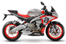 The image shows the EVO-12 Bike-Pack Kit by Ventura for Aprilia Tuono 660, RS660 (21 ->). It includes a black expandable bike pack, an Evo-Rack with Pannier Support, and a generic L-bracket and hardware. Each component is labeled: EVO-12 Pack, Adjustable Pack-Rack, and L-Bracket.
