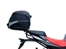 The image shows the EVO-12 Bike-Pack Kit by Ventura for Aprilia Tuono 660, RS660 (21 ->). It includes a black expandable bike pack, an Evo-Rack with Pannier Support, and a generic L-bracket and hardware. Each component is labeled: EVO-12 Pack, Adjustable Pack-Rack, and L-Bracket.
